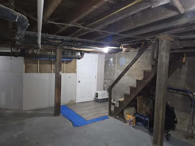 a view of an empty room with stairs