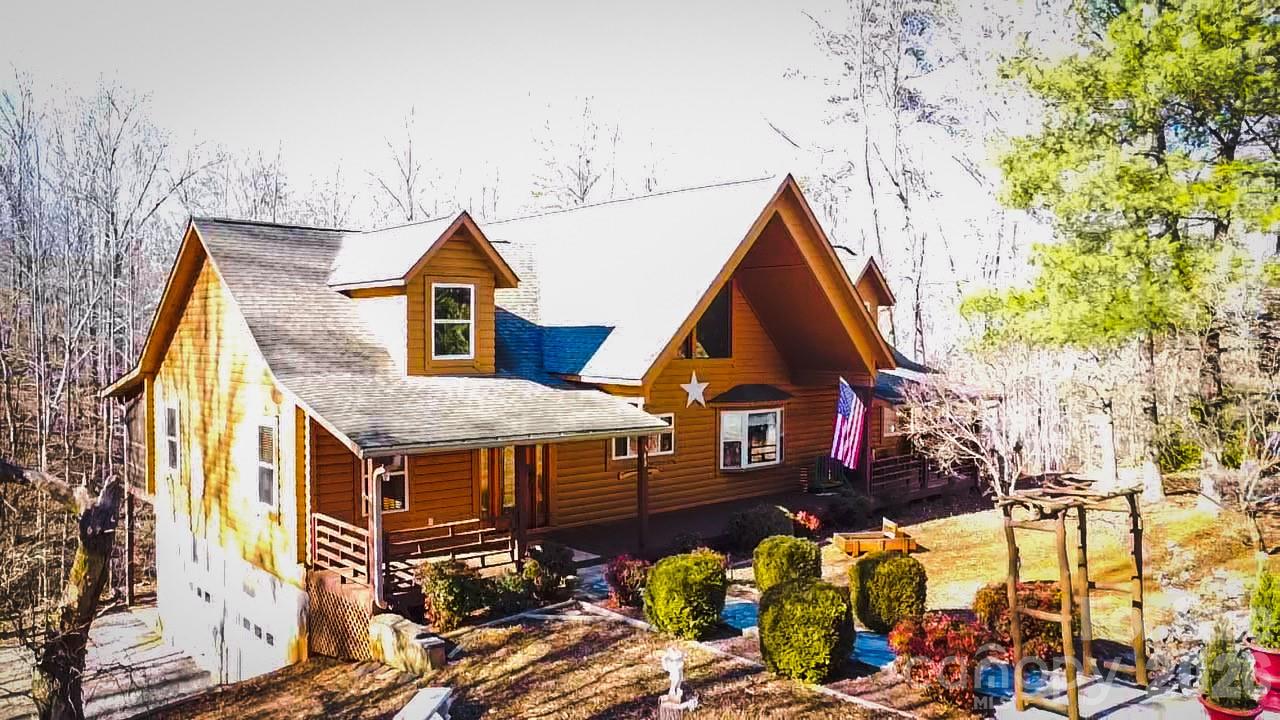a view of a house with wooden fence