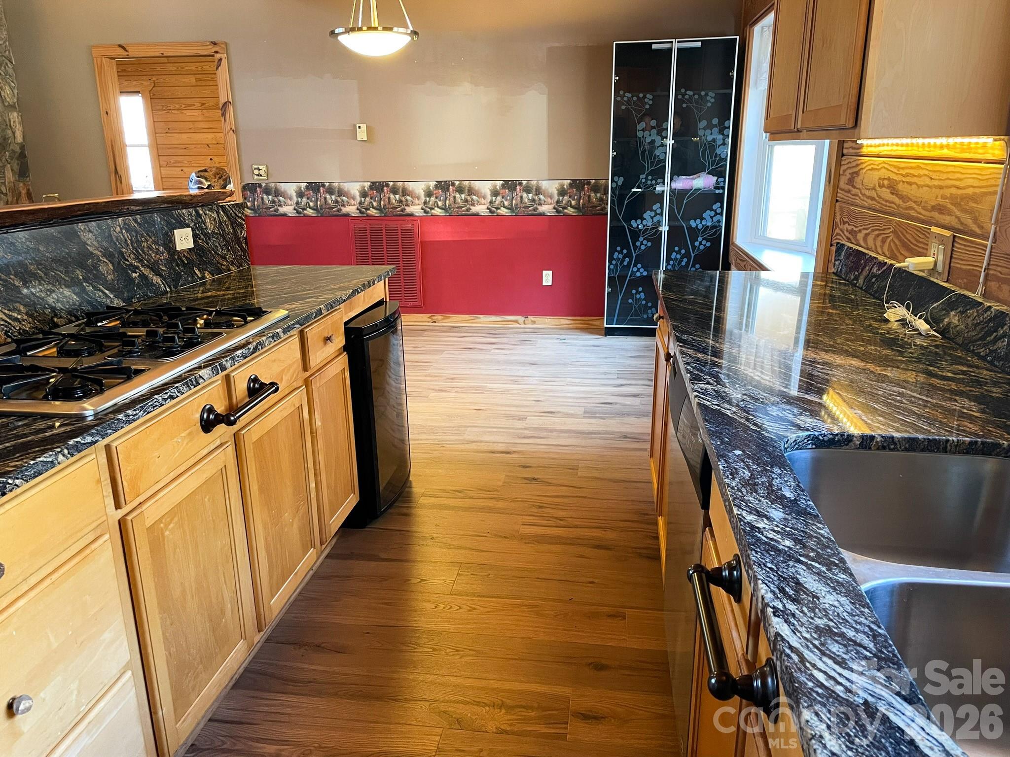 143 Rosewood Lane Rutherfordton, NC 28139 - Photo 17 of 42 a kitchen with stainless steel appliances granite countertop a stove a sink and a microwave