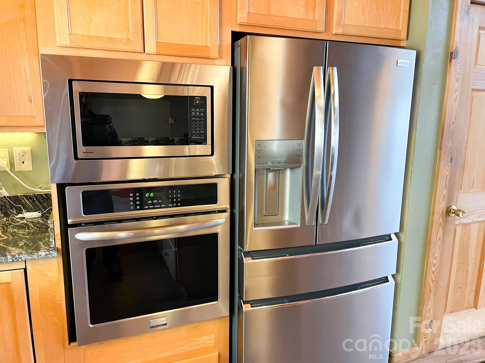 143 Rosewood Lane Rutherfordton, NC 28139 - Photo 19 of 42 a kitchen with a refrigerator stove and microwave