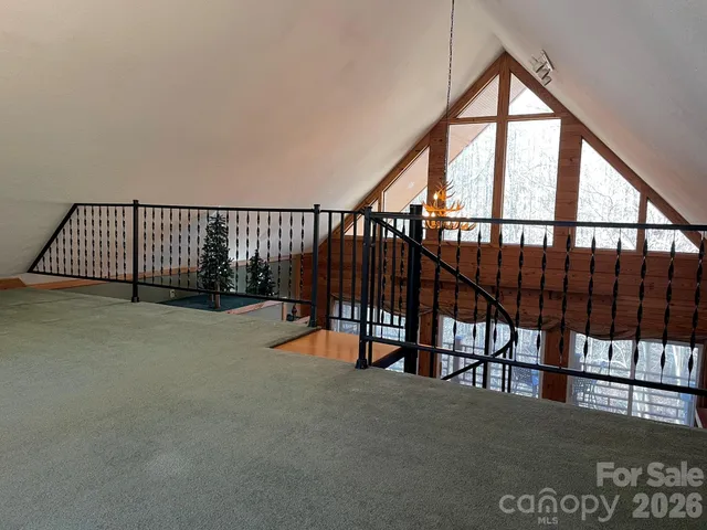 an empty room with large windows