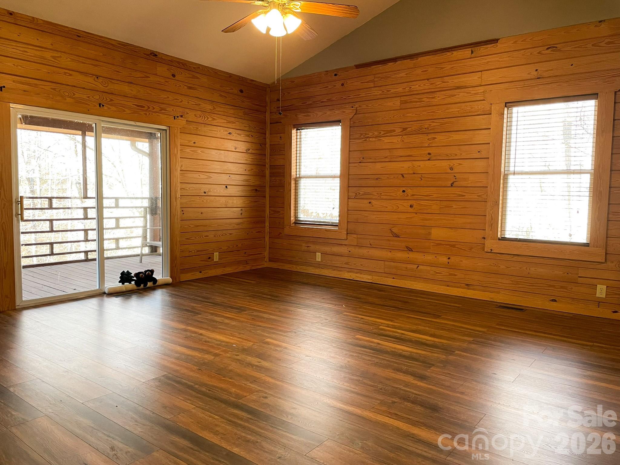 143 Rosewood Lane Rutherfordton, NC 28139 - Photo 22 of 42 an empty room with wooden floor and windows