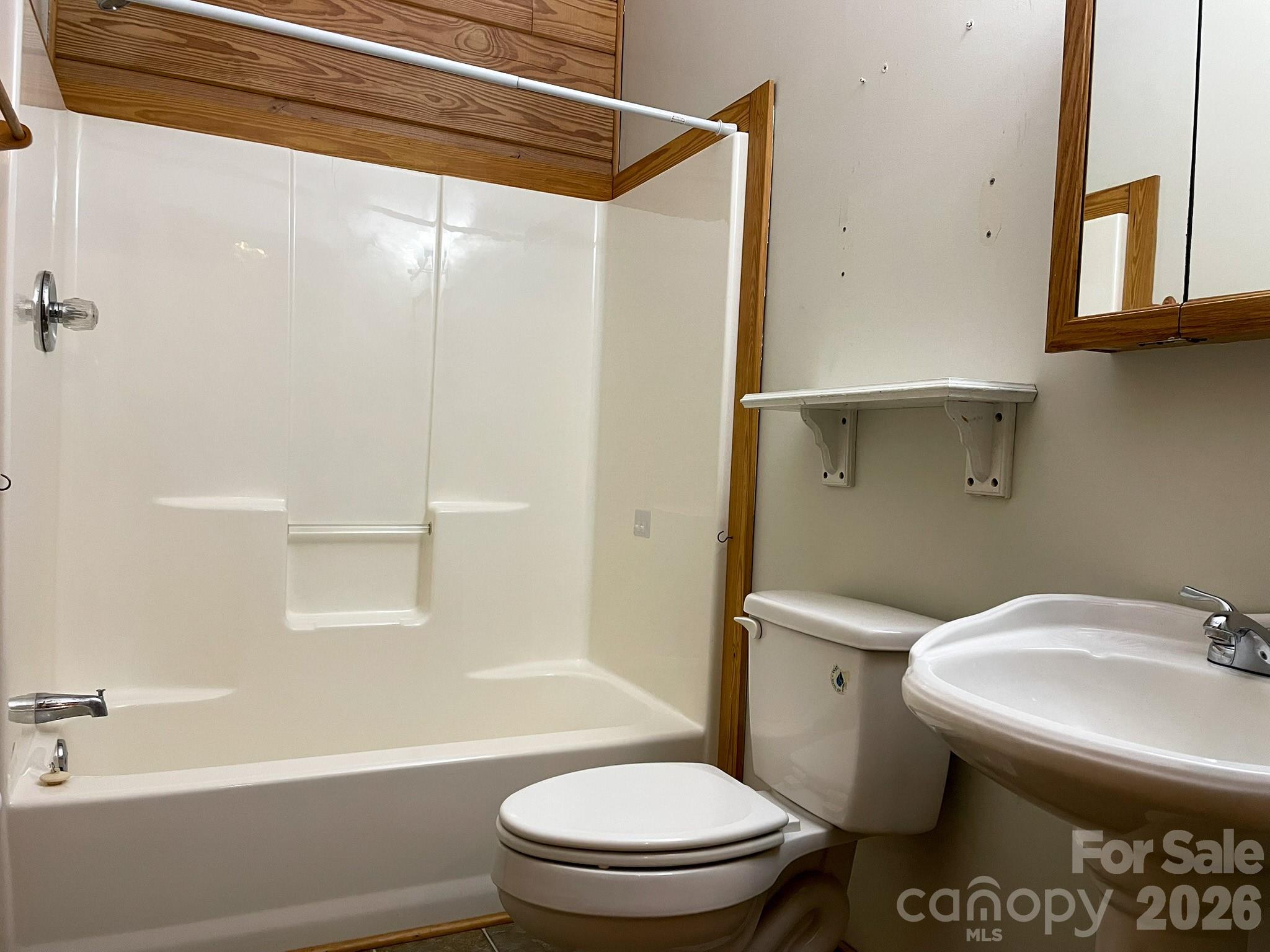 143 Rosewood Lane Rutherfordton, NC 28139 - Photo 28 of 42 a bathroom with a sink a toilet and shower