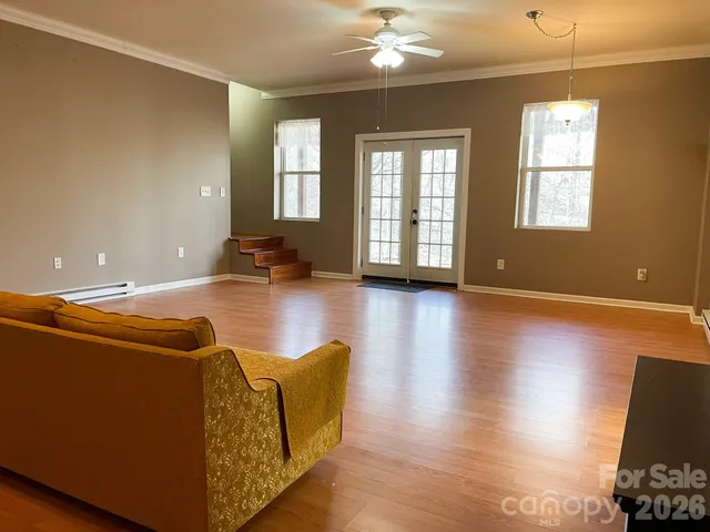 a view of a porch with wooden floor and stairs