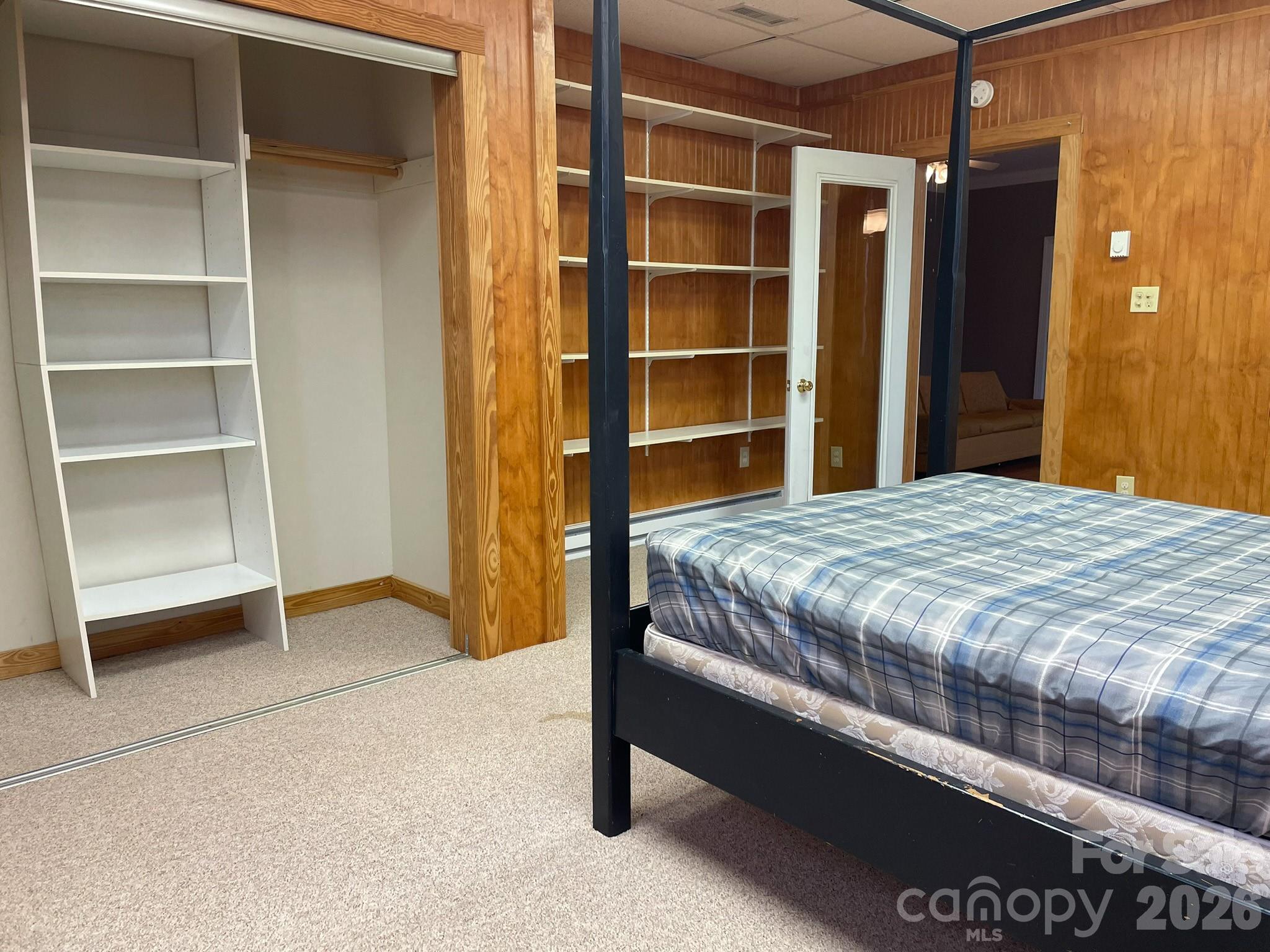 143 Rosewood Lane Rutherfordton, NC 28139 - Photo 34 of 42 a bedroom with a bed and a walk in closet