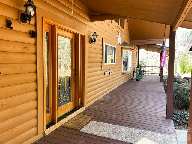 a view of front door with wooden floor
