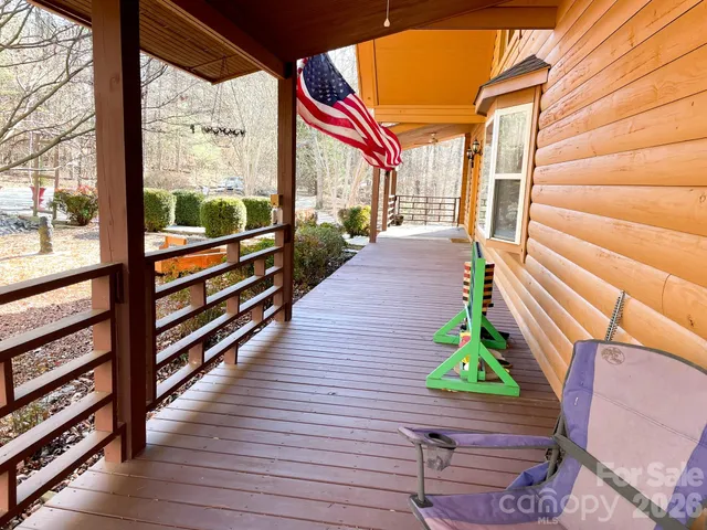 a view of a balcony with wooden floor