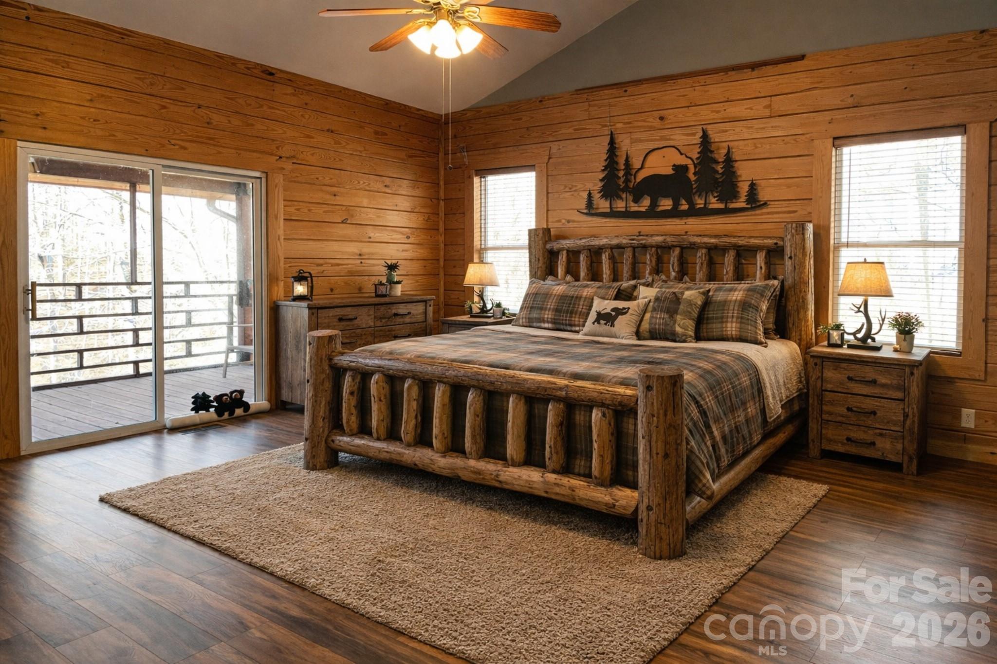 143 Rosewood Lane Rutherfordton, NC 28139 - Photo 5 of 47 a bedroom with a bed and a chandelier