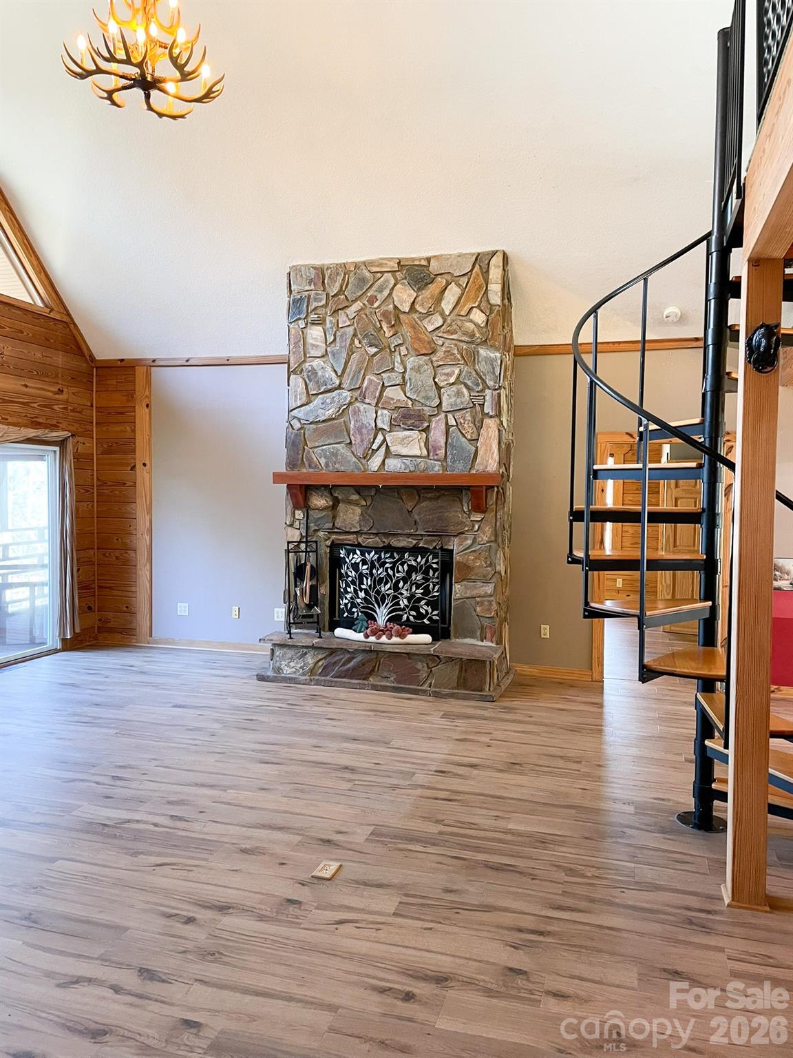 143 Rosewood Lane Rutherfordton, NC 28139 - Photo 9 of 42 a view of empty room with a fireplace and wooden floor