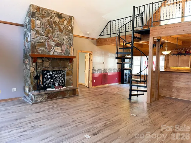 a view of a livingroom with furniture and a fireplace