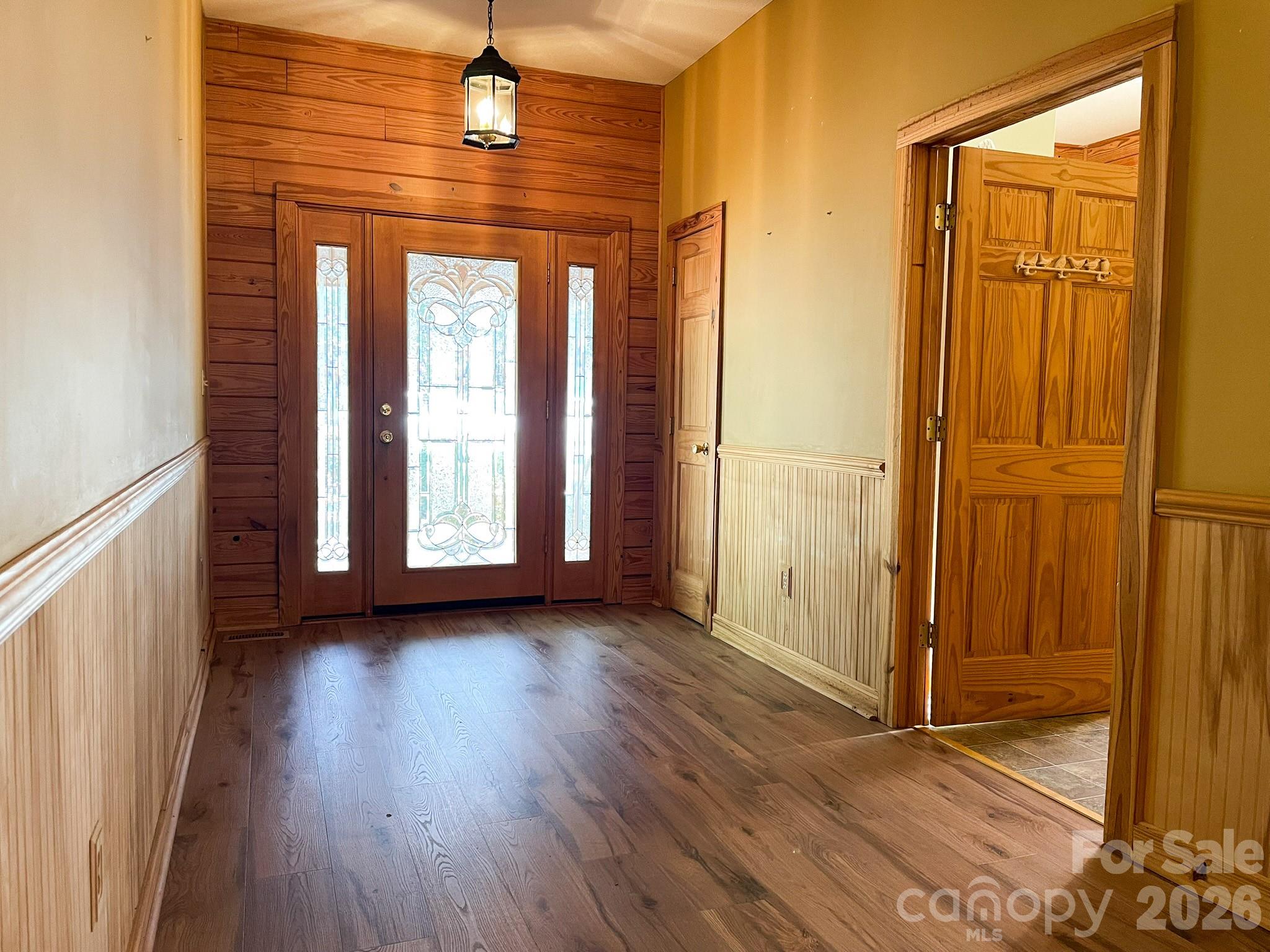 143 Rosewood Lane Rutherfordton, NC 28139 - Photo 10 of 47 an empty room with wooden floor and windows