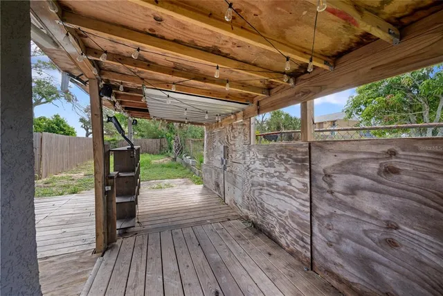 a view of a porch with wooden floor