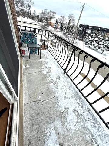 a balcony with wooden floor