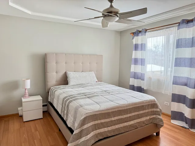 a bedroom with a bed and window