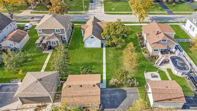 an aerial view of a house with a garden and plants