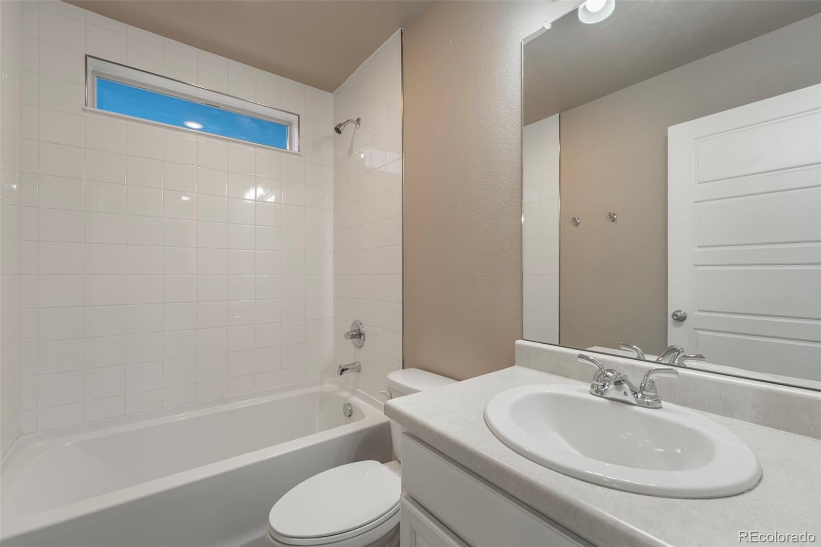 9528 Timberlake Loop Colorado Springs, CO 80927 - Photo 25 of 37 a bathroom with a toilet sink and bathtub