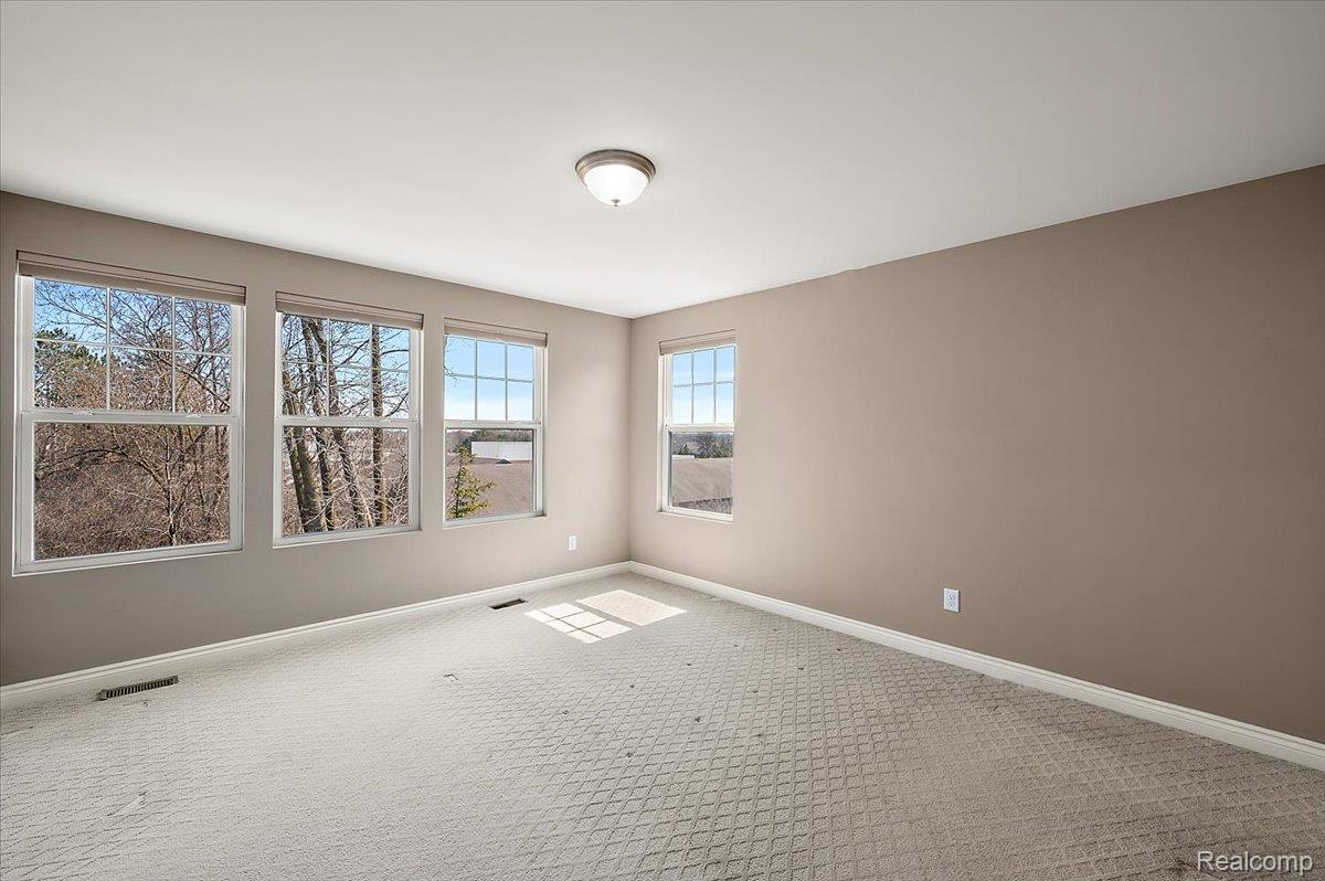 2877 Hartwick Drive Rochester, MI 48307 - Photo 33 of 44 Empty room with baseboards and carpet flooring