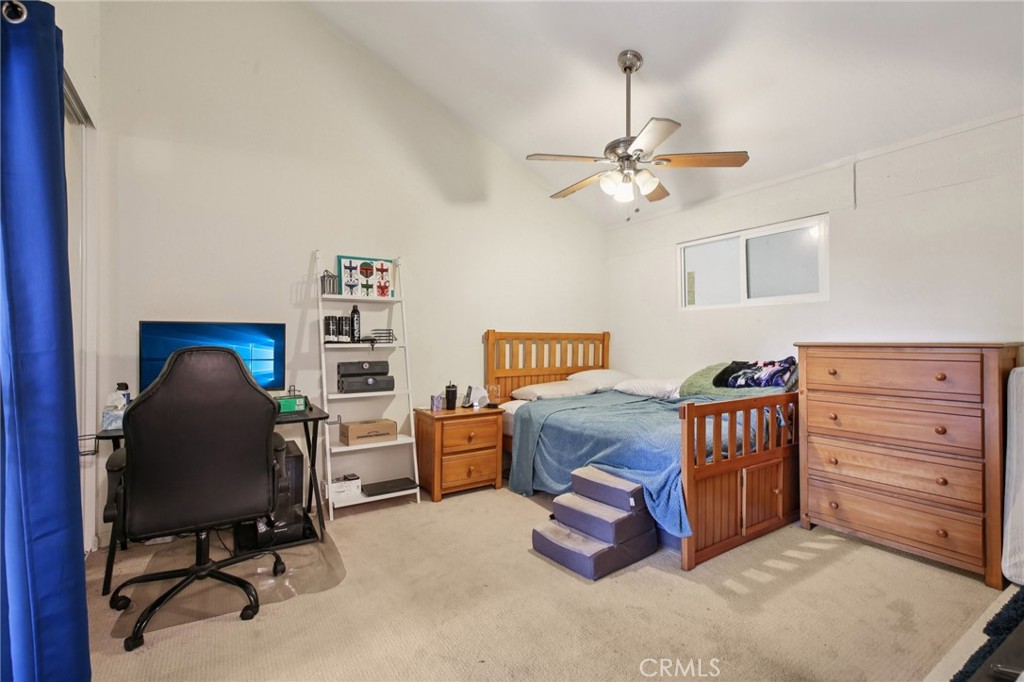 7890 East Spring Street, Unit 16P Long Beach, CA 90815 - Photo 12 of 25 a bedroom with a workspace