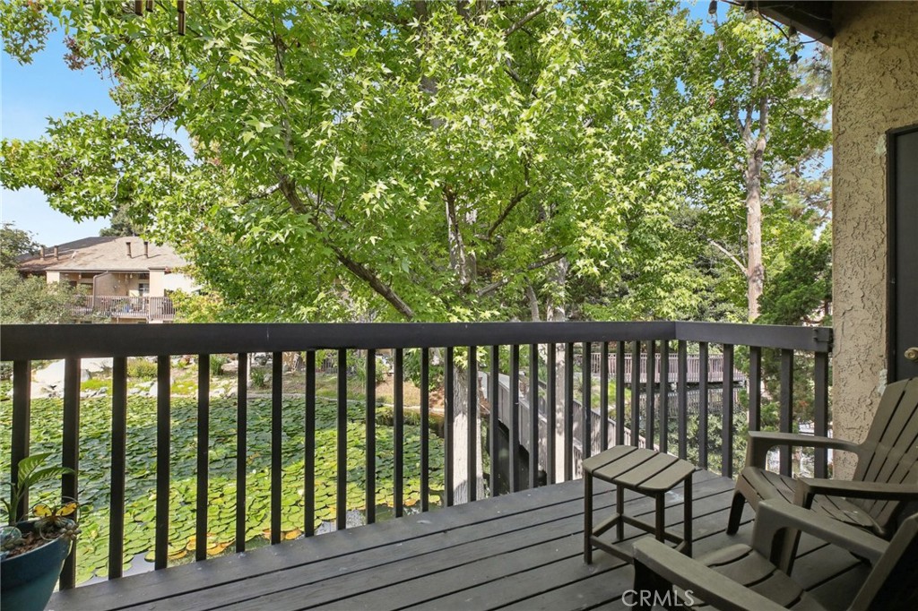 7890 East Spring Street, Unit 16P Long Beach, CA 90815 - Photo 18 of 25 a view of balcony with wooden floor