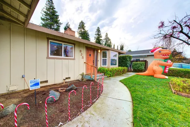 a front view of a house with garden