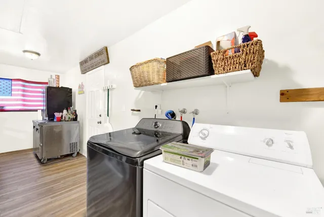 front view of a house with a yard and a garden