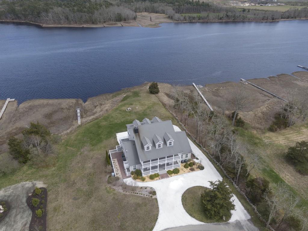 an aerial view of a house with a ocean view