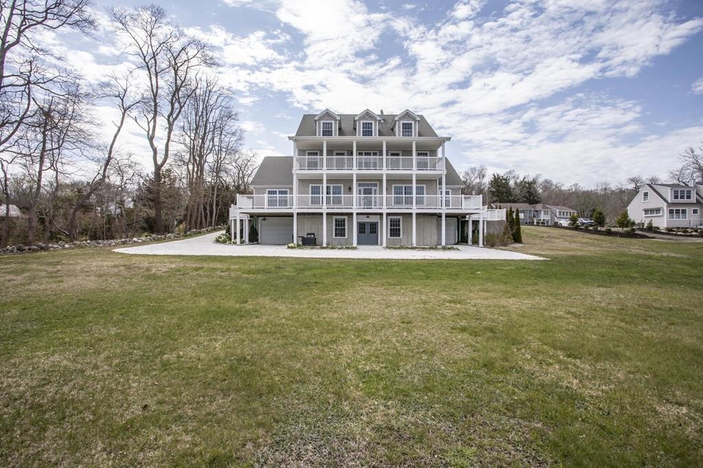 922 Drift Road Westport, MA 02790 - Photo 14 of 42 a front view of building with yard