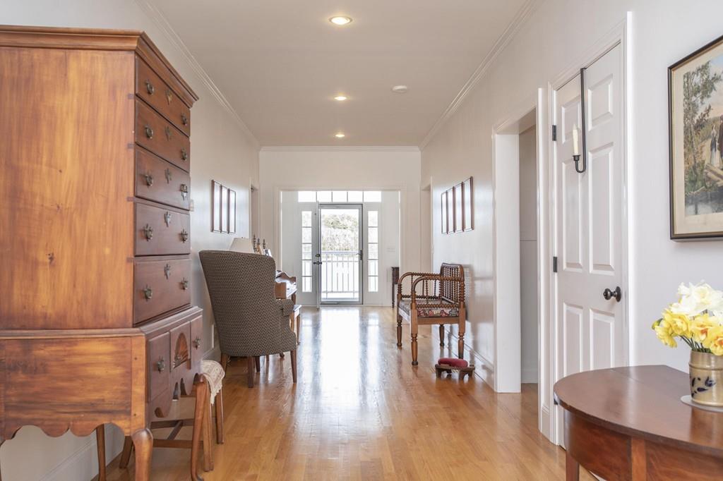 922 Drift Road Westport, MA 02790 - Photo 17 of 42 a view of a dining room with furniture and wooden floor