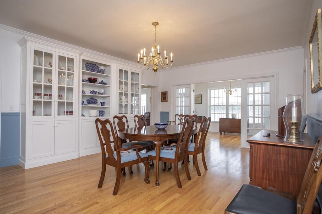 922 Drift Road Westport, MA 02790 - Photo 28 of 42 a view of a dining room with furniture window and wooden floor
