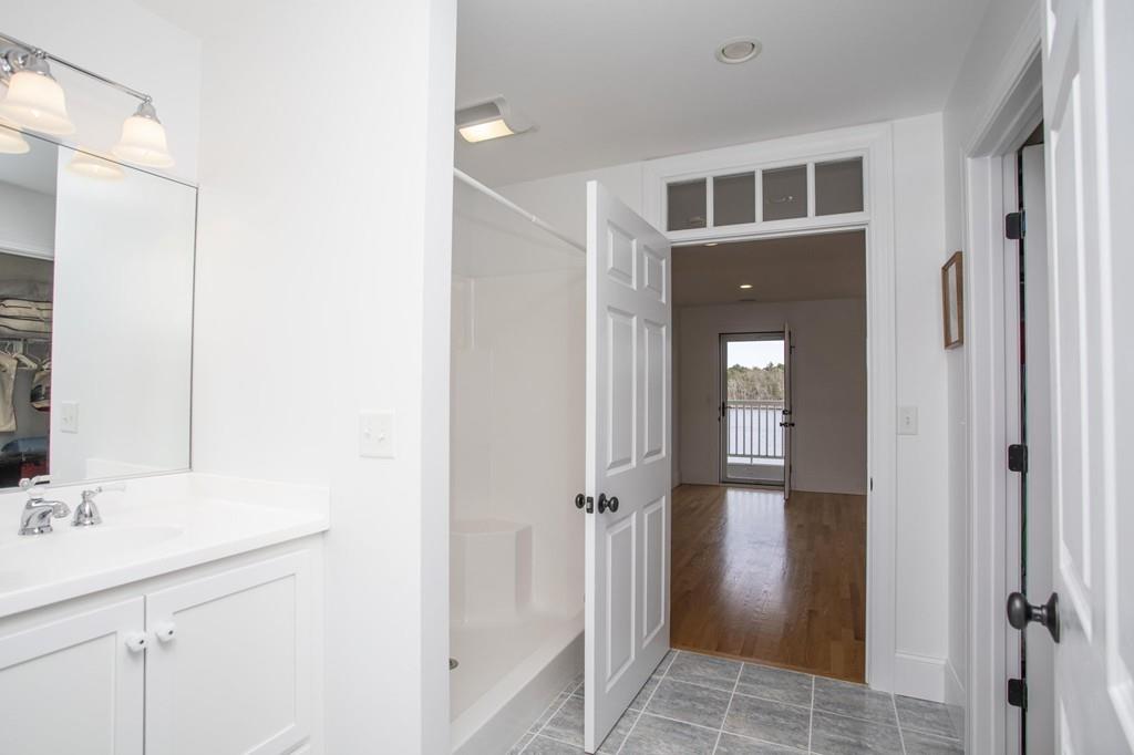 922 Drift Road Westport, MA 02790 - Photo 37 of 42 a bathroom with a sink and a mirror