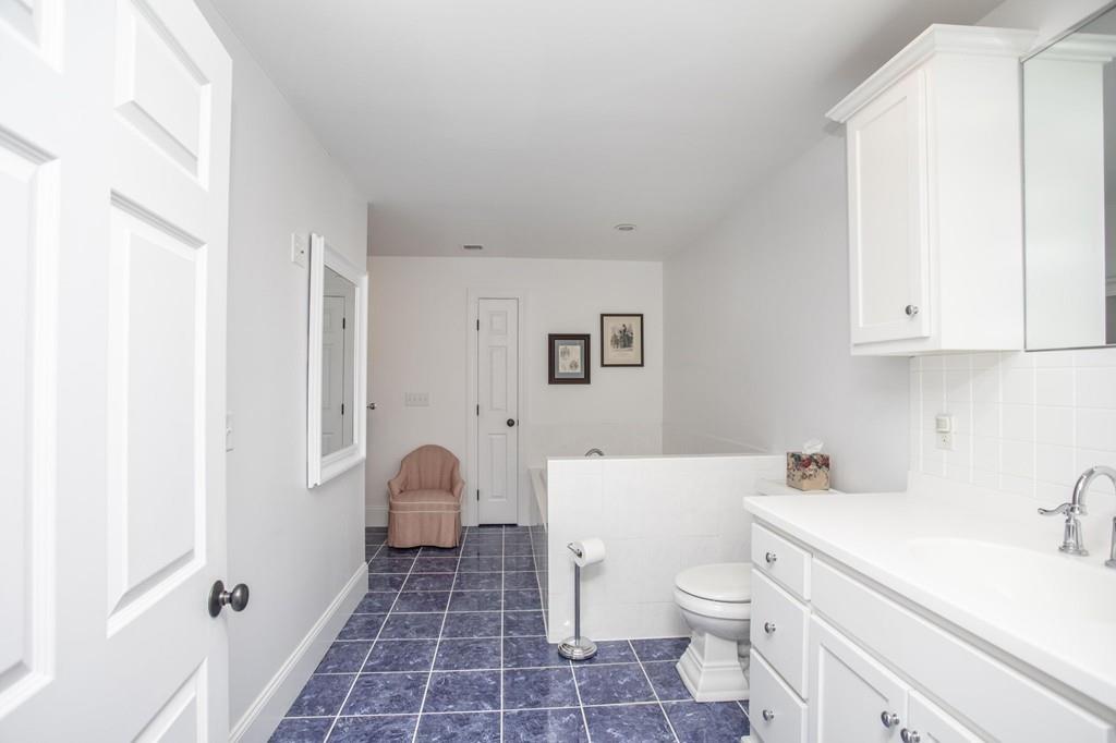 922 Drift Road Westport, MA 02790 - Photo 42 of 42 a bathroom with a sink toilet and shower