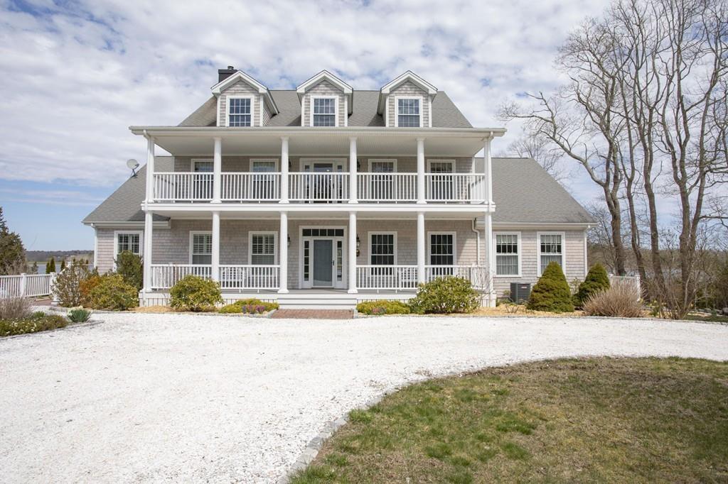 922 Drift Road Westport, MA 02790 - Photo 6 of 42 a front view of a residential apartment building with a yard