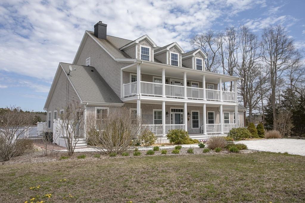 922 Drift Road Westport, MA 02790 - Photo 7 of 42 a front view of a house with a yard