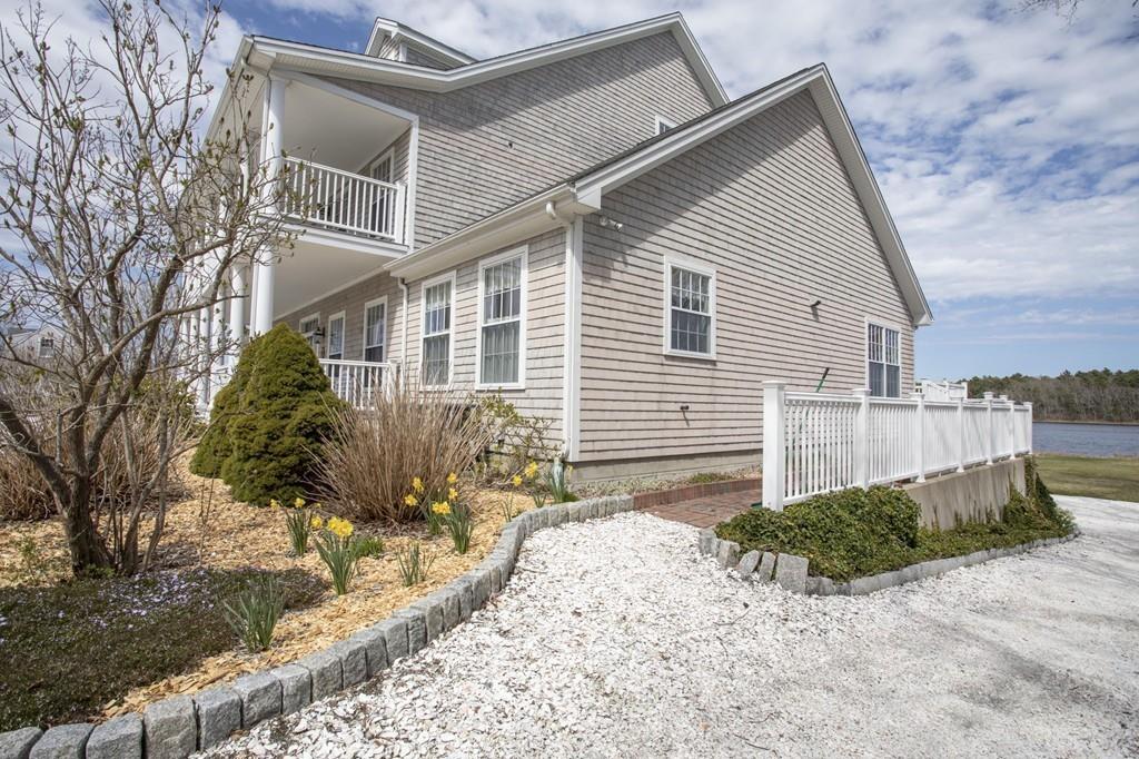 922 Drift Road Westport, MA 02790 - Photo 10 of 42 a view of a house with a yard and large tree