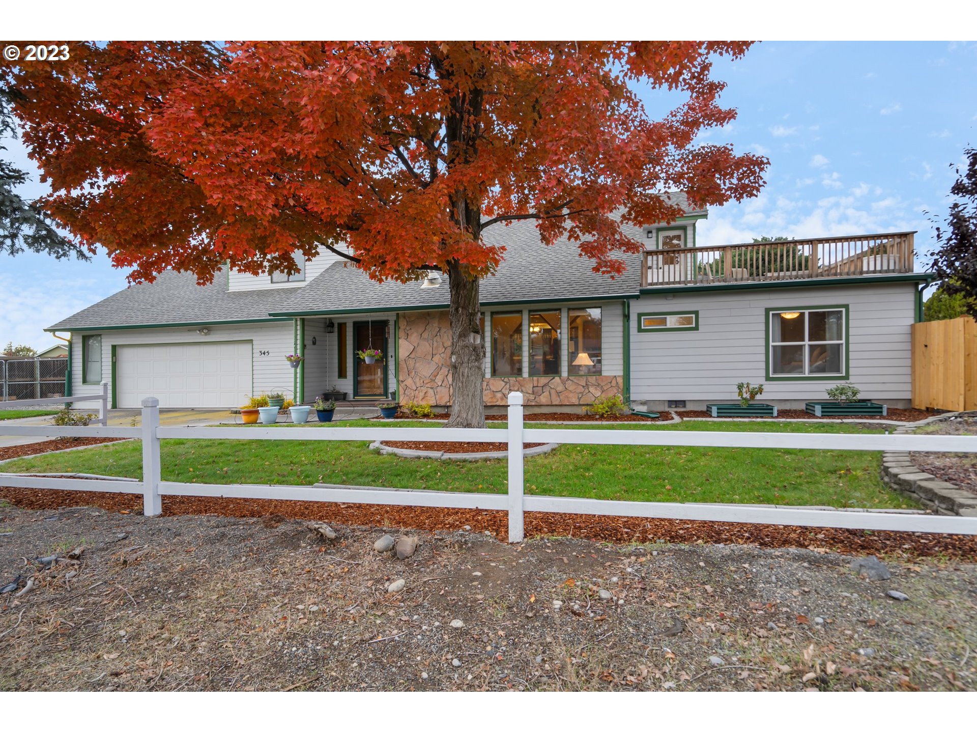 345 3rd Street Northeast Irrigon, OR 97844 - Photo 1 of 39 a front view of a house with a yard and porch