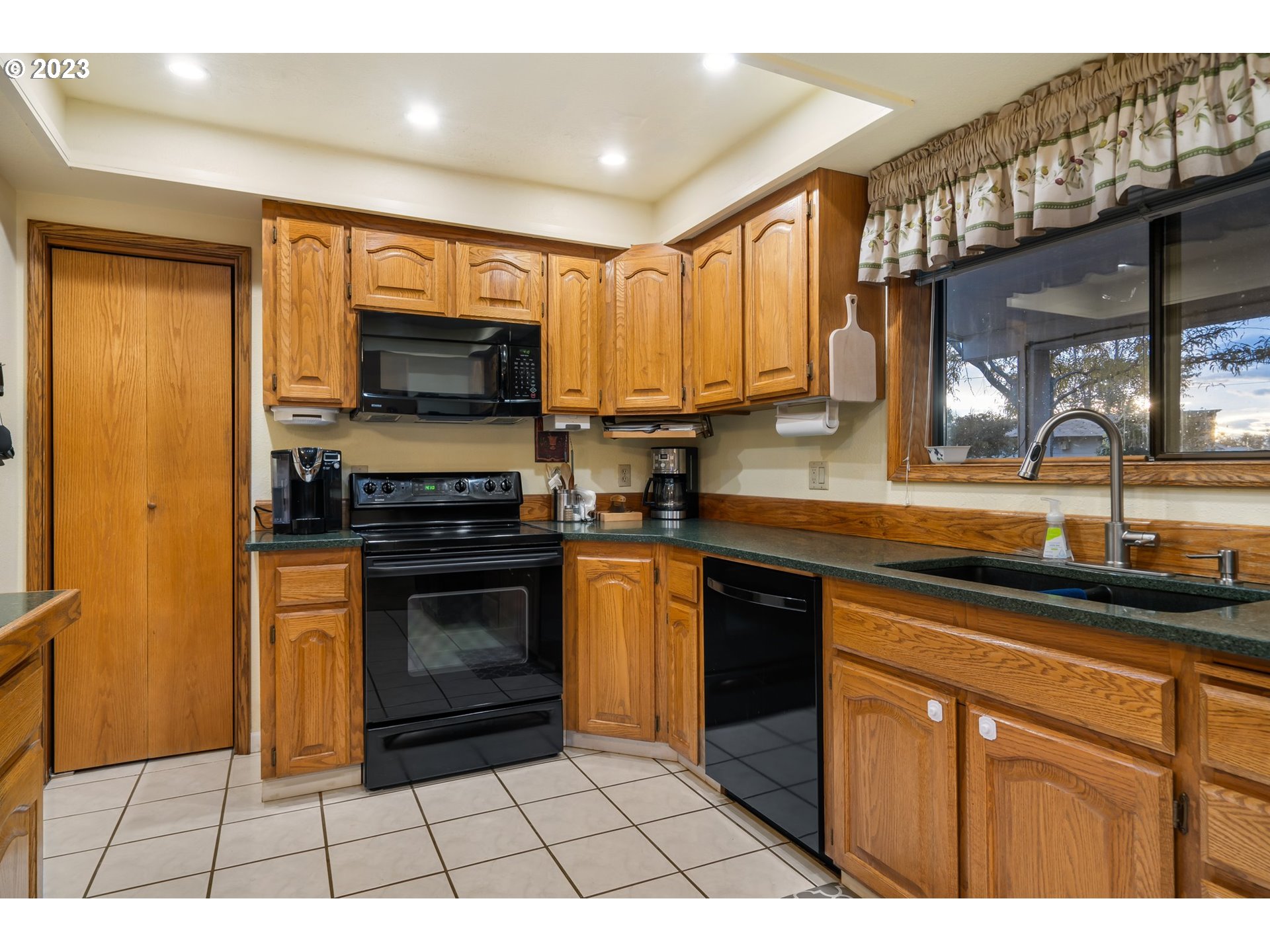 345 3rd Street Northeast Irrigon, OR 97844 - Photo 11 of 39 a kitchen with stainless steel appliances a stove sink microwave and cabinets