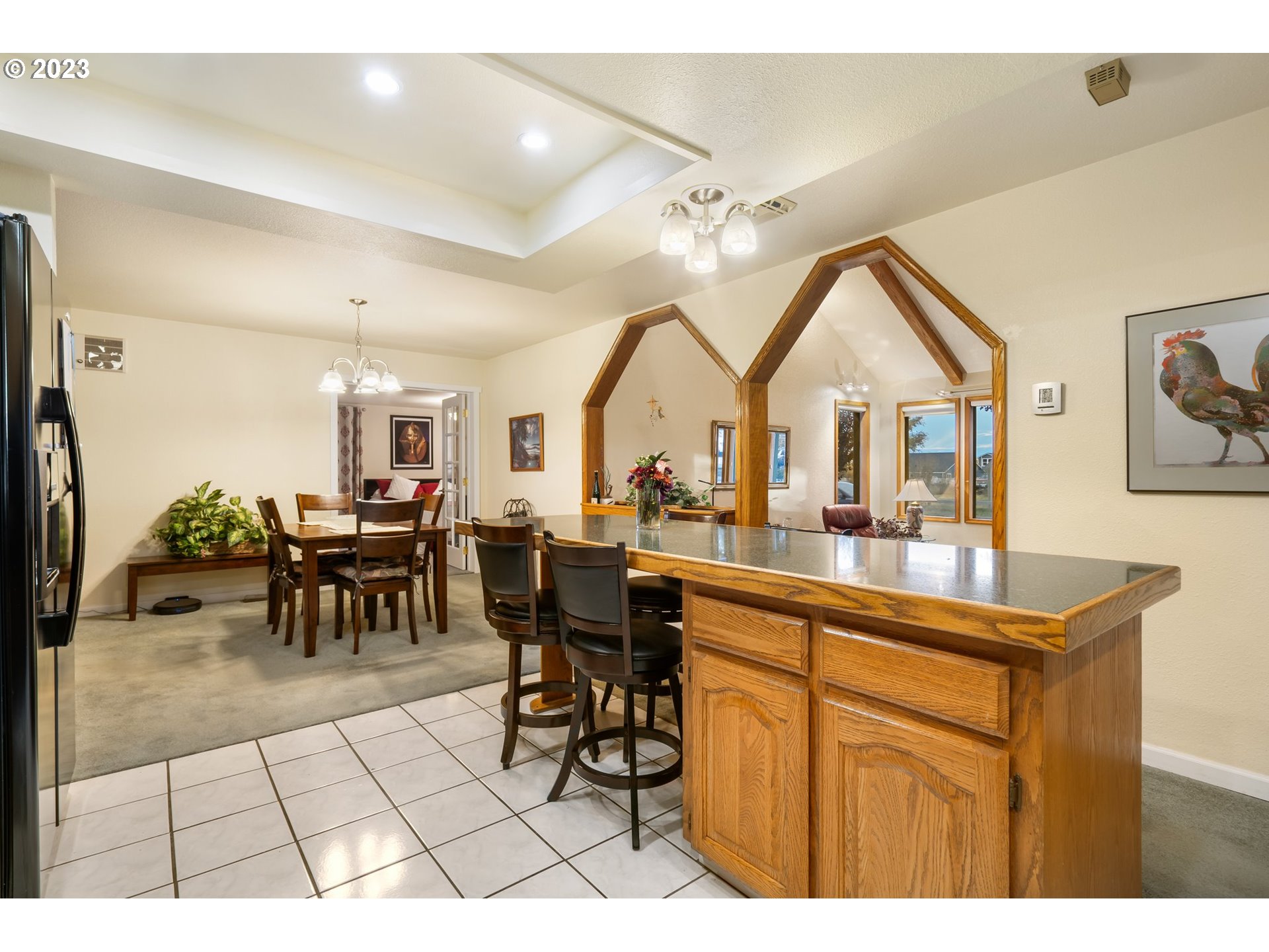 345 3rd Street Northeast Irrigon, OR 97844 - Photo 12 of 39 a living room with furniture a dining table and a large window