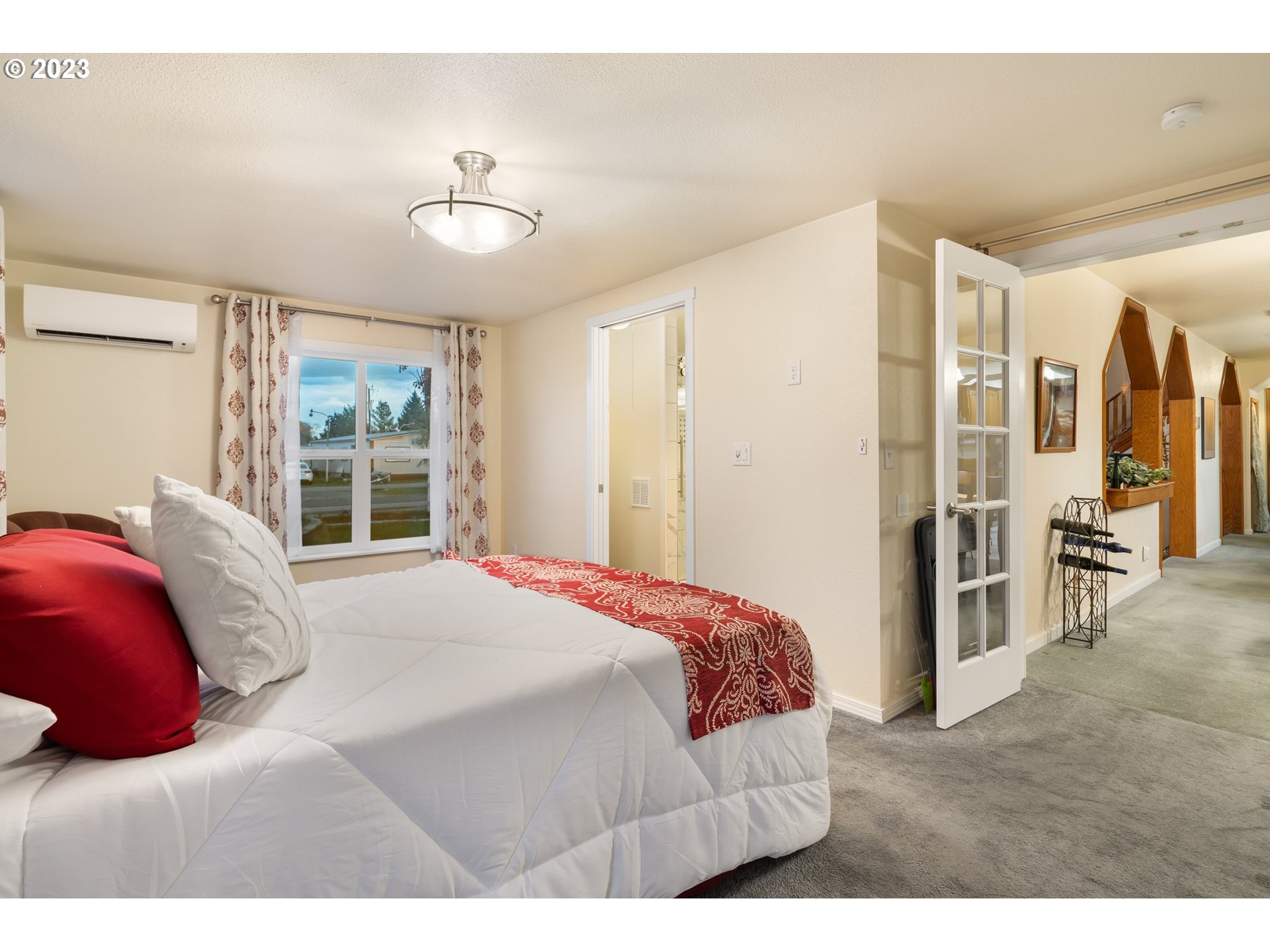 345 3rd Street Northeast Irrigon, OR 97844 - Photo 18 of 39 a bedroom with a large bed and a large window