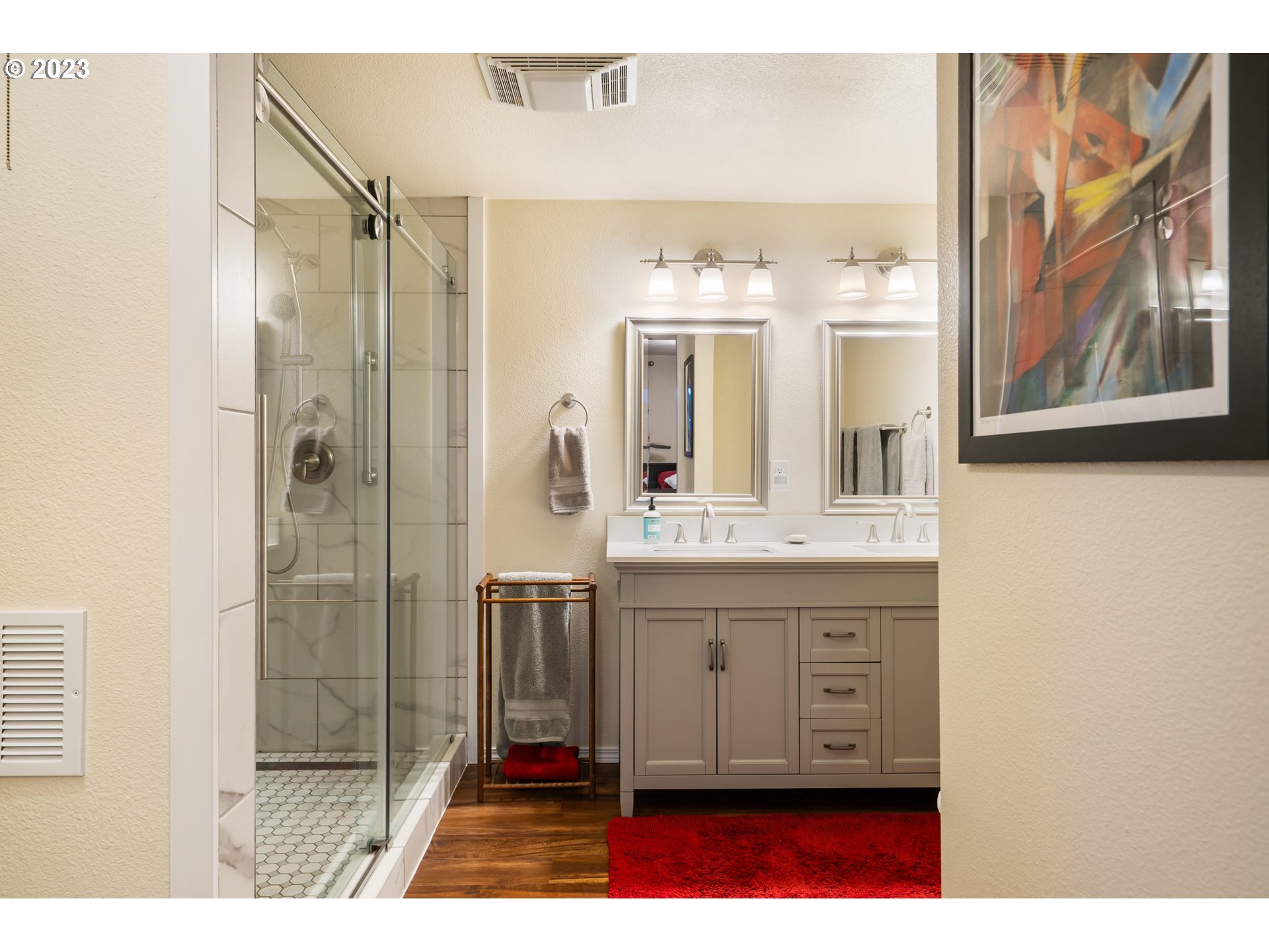 345 3rd Street Northeast Irrigon, OR 97844 - Photo 19 of 39 a bathroom with a double vanity sink mirror and shower