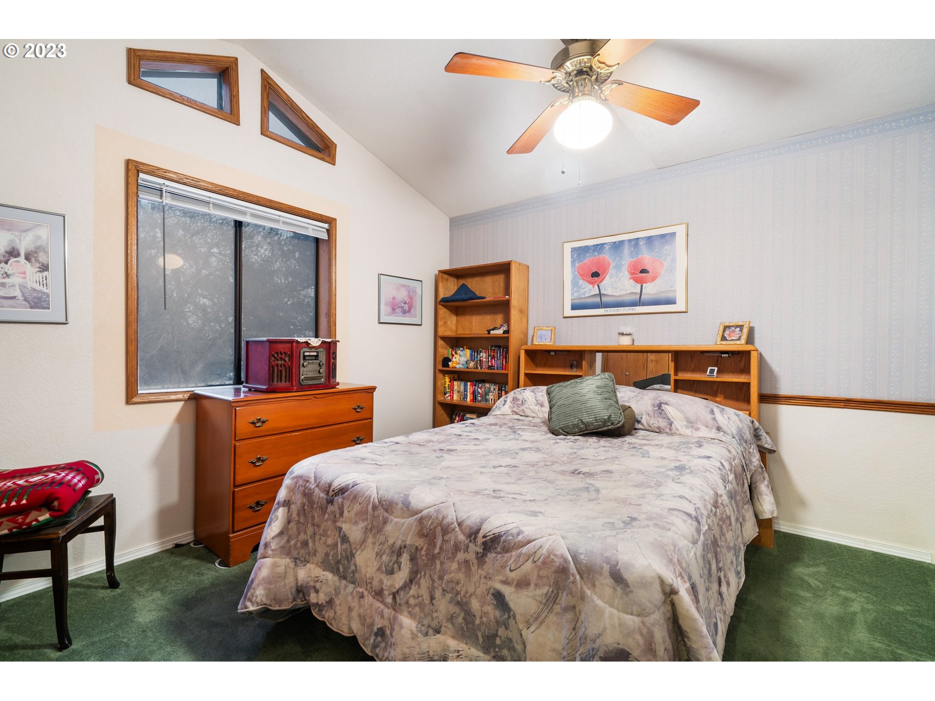 345 3rd Street Northeast Irrigon, OR 97844 - Photo 27 of 39 a bedroom with a bed and a chandelier
