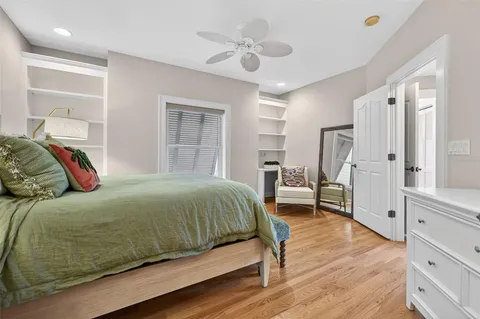 a view of a balcony with floor to ceiling window wooden floor