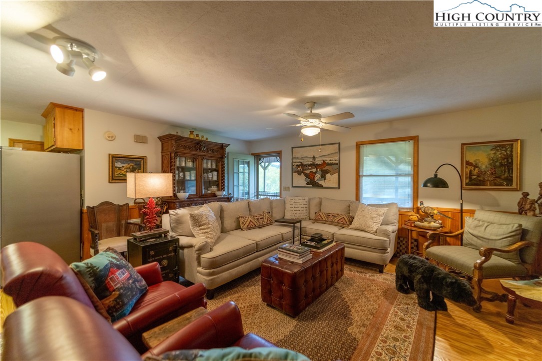 2161 River Bend Road Mouth Of Wilson, VA 24363 - Photo 12 of 47 a living room with furniture and a chandelier