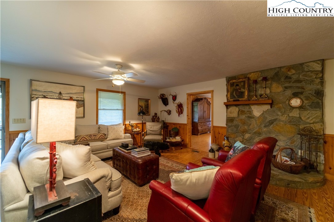 2161 River Bend Road Mouth Of Wilson, VA 24363 - Photo 13 of 47 a living room with furniture and a fireplace