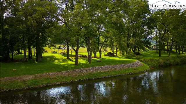 a view of a lake with a yard