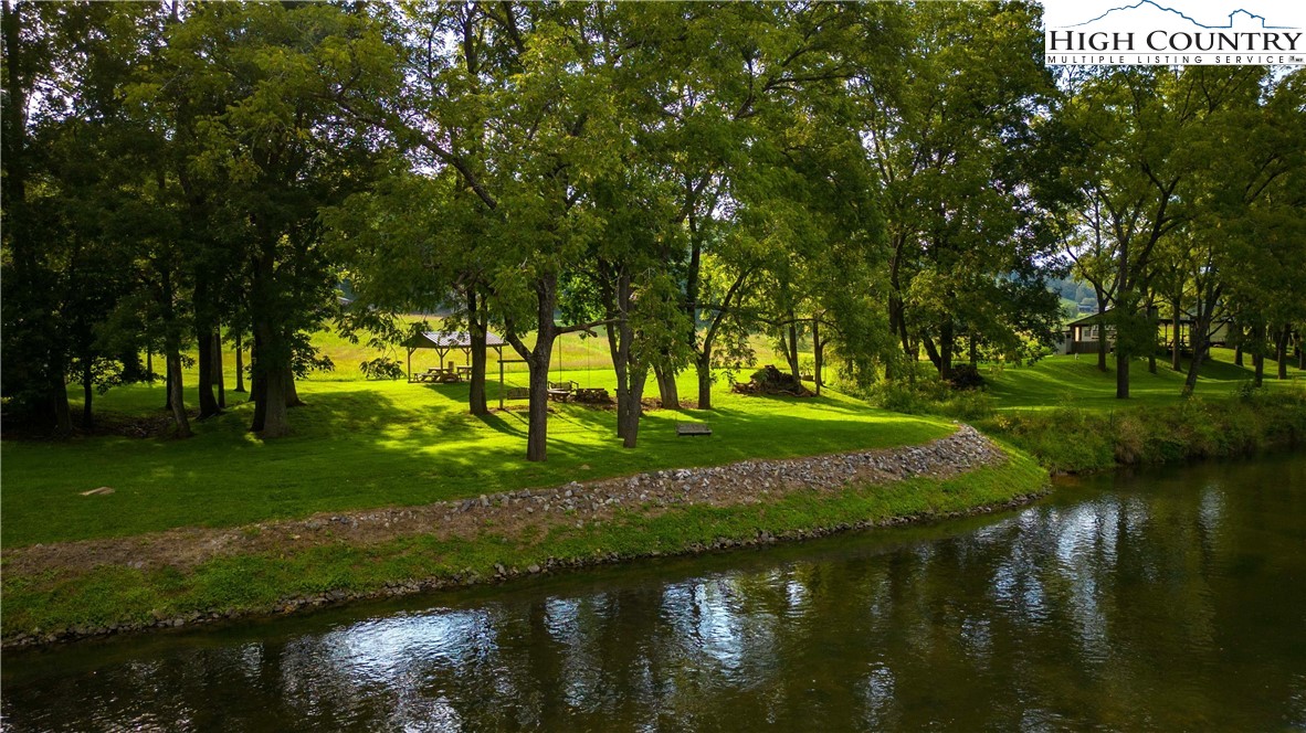 2161 River Bend Road Mouth Of Wilson, VA 24363 - Photo 2 of 47 a view of a lake with a yard