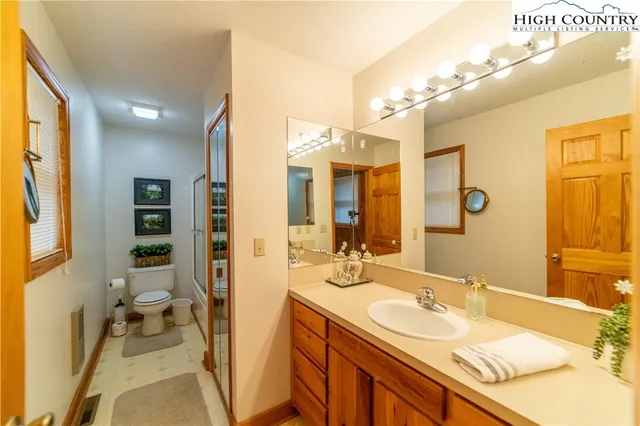 a spacious bathroom with a sink double vanity and a mirror