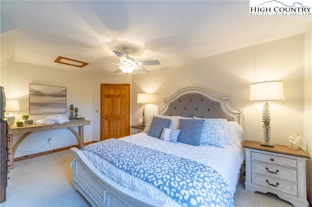 a bedroom with a large bed and a dresser