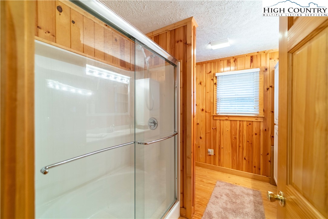 2161 River Bend Road Mouth Of Wilson, VA 24363 - Photo 29 of 47 a bathroom with a glass shower door