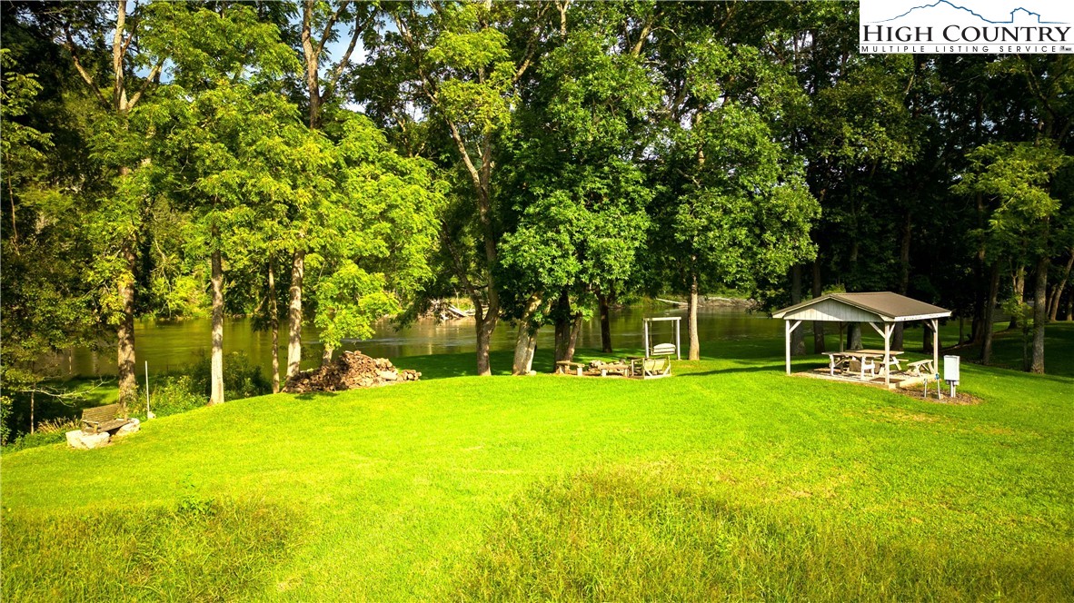 2161 River Bend Road Mouth Of Wilson, VA 24363 - Photo 32 of 47 a view of a house with a big yard and large trees