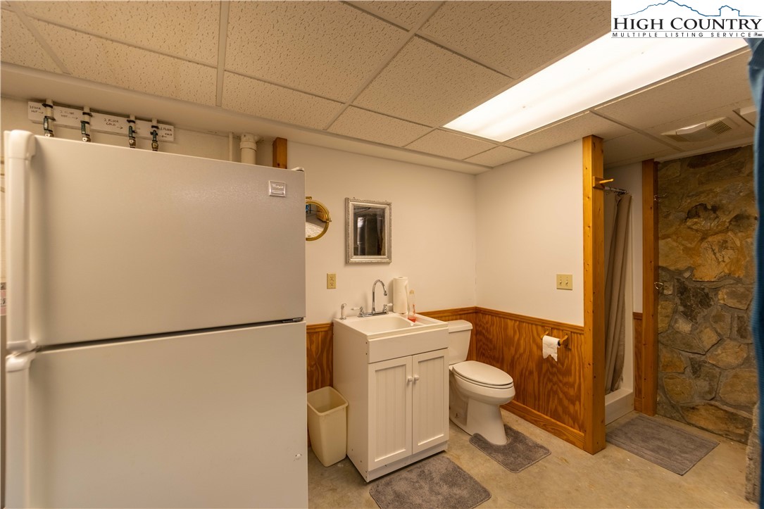 2161 River Bend Road Mouth Of Wilson, VA 24363 - Photo 36 of 47 a white toilet sitting next to a bathroom sink